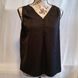 Black sleeveless blouse with a V-neck and button detailing 100% polyester